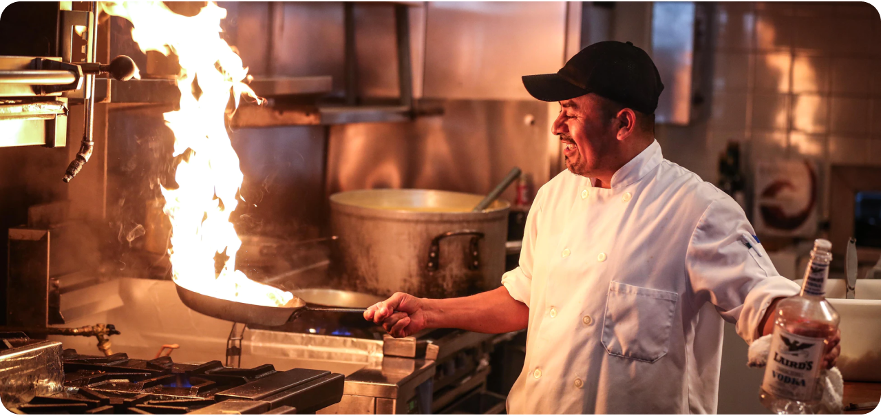 Chef cooking with passion in Foodieland kitchen